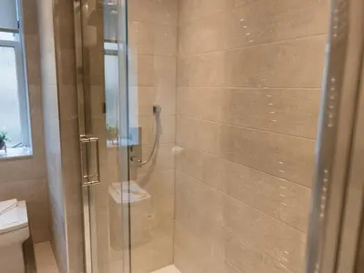 a shower with a glass door in a bathroom at Superb 1Bed Flat in Fabulous West End - Pass the Keys in Glasgow