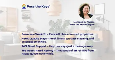 a woman is standing in a room with a poster at Superb 1Bed Flat in Fabulous West End - Pass the Keys in Glasgow