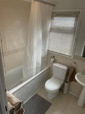 a bathroom with a toilet and a tub and a sink at 1-Bedroom Chalet at Maryville Caravan Site - Uddingston, Glasgow in Uddingston