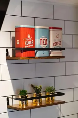 a group of books on a shelf on a wall at The West End Loft - 5* Retreat - Private Parking! in Glasgow