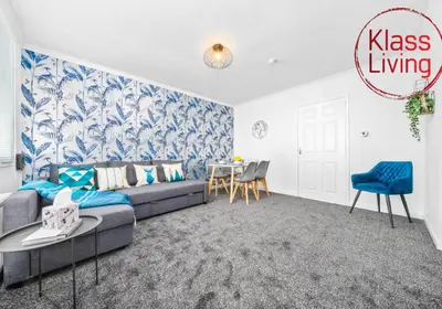a living room with a couch and a table at West End House by Klass Living Bellshill in Bellshill