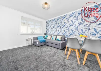 a living room with a couch and a table at West End House by Klass Living Bellshill in Bellshill