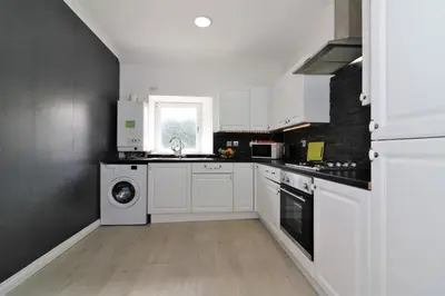 a white kitchen with a sink and a dishwasher at Signature - Kirkhill Middle in Kirkmuirhill
