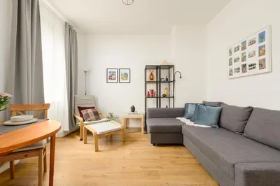 a living room with a couch and a table at Heriot Bridge Hideaway by Calton Living in Edinburgh