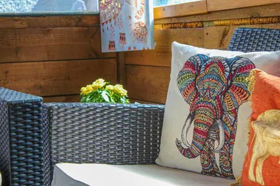 a pillow with an elephant on it sitting on a table at Station Signature Apartment near Lanark in Carstairs