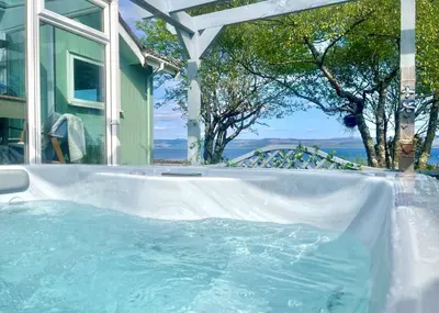 a large jacuzzi tub in a house with at Bay View in Lochgilphead