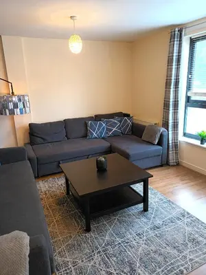 a living room with a couch and a coffee table at Fabulous 2 bed apt 10 mins from City Centre in Glasgow