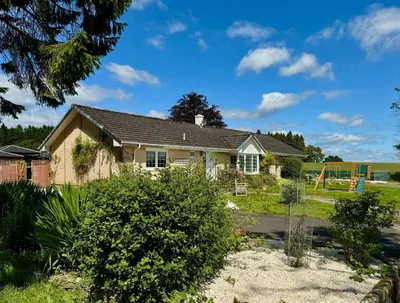 a house with a garden in front of it at FINN VILLAGE 