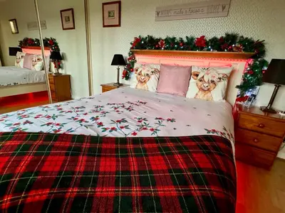 a bedroom with a bed with three dogs on it at FINN VILLAGE 
