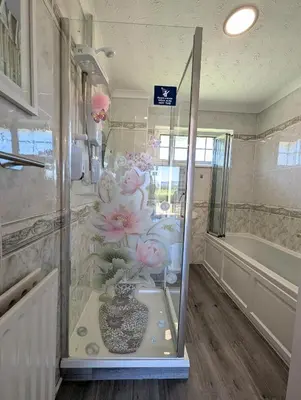 a bathroom with a vase with flowers on the wall at FINN VILLAGE 