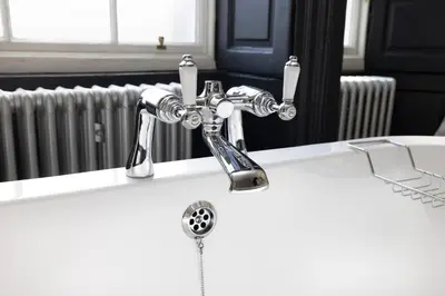 a bathroom sink with a chrome bathroom faucet at JOIVY Contemporary Flat in the New Town in Edinburgh