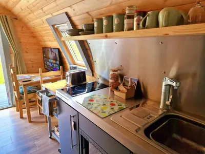 a kitchen with a sink and a counter top at Bothan Creag Sobhrag in Ballachulish