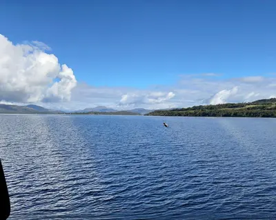 a large body of water with a boat in it at The Rhu Inn in Rhu