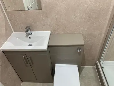 a bathroom with a sink and a toilet and a mirror at Ibrox Argyll Inn in Glasgow