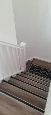 a stairway with a white railing and wooden stairs at Lanarkshire Apartment- Views- Sleeps 4- Balcony in Larkhall