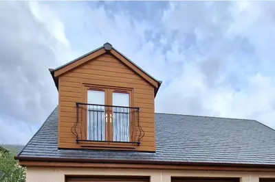 a building with a balcony on top of it at Lanarkshire Apartment- Views- Sleeps 4- Balcony in Larkhall