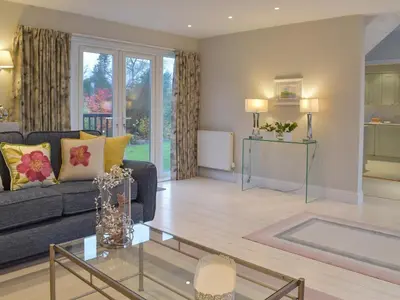 a living room with a couch and a table at Whitehouse Studio in Roslin