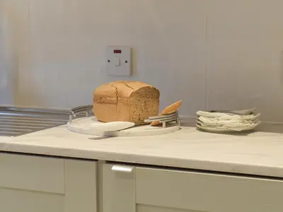 a loaf of bread on a plate on a counter at Whitehouse Studio in Roslin
