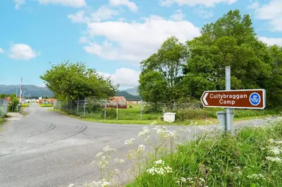 a street sign on the side of a road at Cultybraggan Hut 37 in Comrie
