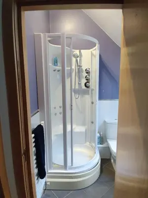 a shower in a bathroom with a toilet at West End & EICC with Parking in Edinburgh