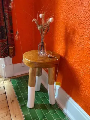 a small table with a vase on top of it at Lovely flat overlooking the Clyde in Gourock