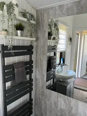 a bathroom with a sink and a mirror at Amazing Loch Views in Kilmun