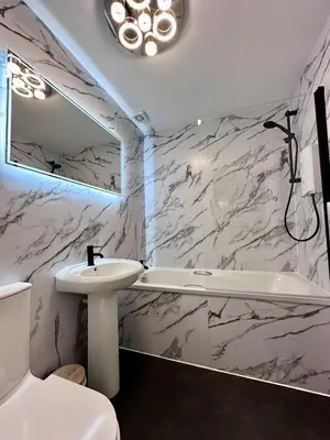 a bathroom with a sink and a tub and a toilet at Rose Street's Hidden Treasure- 2Bed Newly Refurbished Apt in Edinburgh