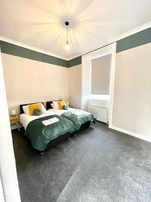 a bedroom with a bed and a window in it at Stevenson Apartment in Alexandria