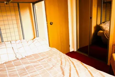 a bedroom with a bed in a room with a window at Links Quay 42 in Prestwick