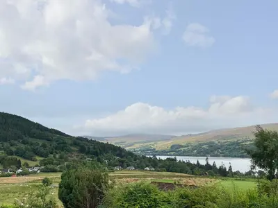 a view of a valley with a body of water at Ciaran Cottage in Stron-fearnan