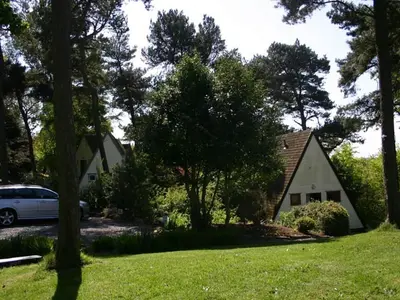 a house and a car parked in a yard at Ledi - Cottage in Linlithgow