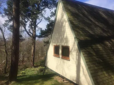a house with two windows on the side of it at Ledi - Cottage in Linlithgow