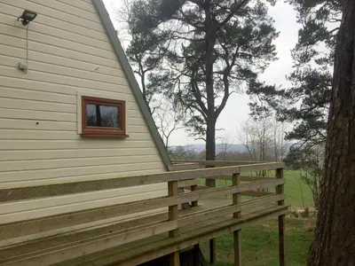 a porch with a window on the side of a house at Ledi - Cottage in Linlithgow