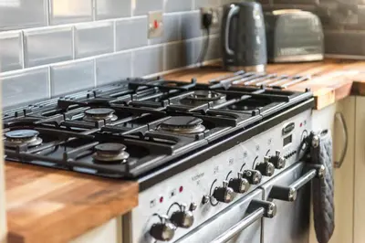 a stove top oven sitting in a kitchen at Cosy Roseburn Apartment, Edinburgh - 2 Bedrooms, FREE PARKING in Edinburgh