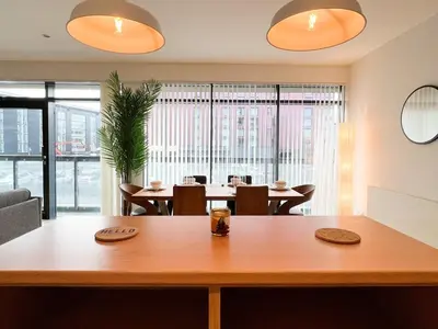 a dining room with a table and chairs at Lovely two bed apartment in Finnieston in Glasgow