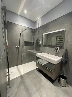 a bathroom with a sink and a shower at Laurieston Inn in Falkirk