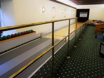 a row of bowling lanes in a hall at Manyleith Rig Cottage in Polmood