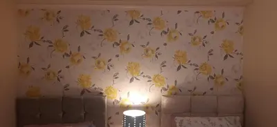 a bedroom with a wallpaper with yellow flowers on it at Delightful home stay - Double ensuiteroom. in Glasgow