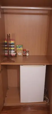 a shelf in a room with a white desk at Delightful home stay - Double ensuiteroom. in Glasgow