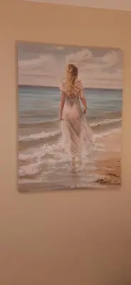 a painting of a woman walking in the ocean at Delightful home stay - Double ensuiteroom. in Glasgow
