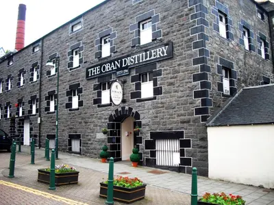 a brick building with a sign that reads the ocean quarry at The Distillers Den in Oban