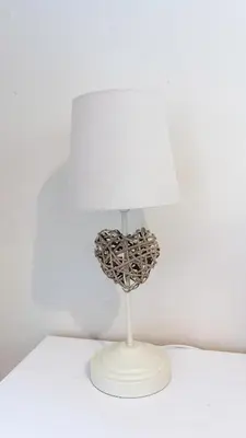a white lamp with a white lampshade on a table at The Riverside in Alloa