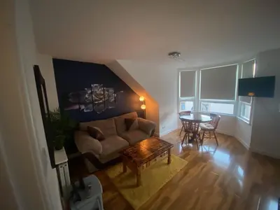 a living room with a couch and a table at cosy 1 bed flat Largs in Largs