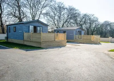 twounits of a tiny house in a parking lot at Arran Hills in Kilwinning