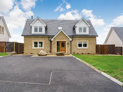 a house with a driveway in front of it at Fiadh Ruadh-Uk40008 in Gartmore