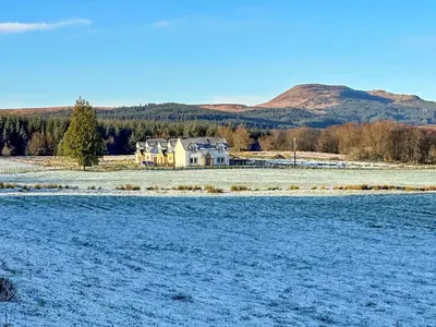 a house in the middle of a snow covered field at Gartclach-Uk40001 in Gartmore
