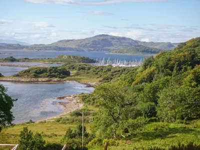 a view of a river with a bunch of boats at Siskin Lodge - Uk39664 in Lunga