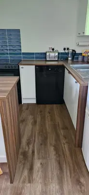 a kitchen with a sink and a dishwasher at Seaview cosy 2 bed home in Lamlash - 'Mid Drive' in Lamlash