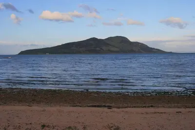 an island in the middle of the ocean with a beach at Seaview cosy 2 bed home in Lamlash - 'Mid Drive' in Lamlash