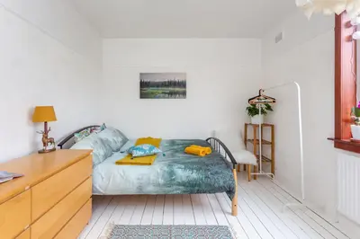 a bedroom with a bed and a dresser in it at Bright & Spacious Double Room with Garden View- Close to Airport & City Centre in Edinburgh